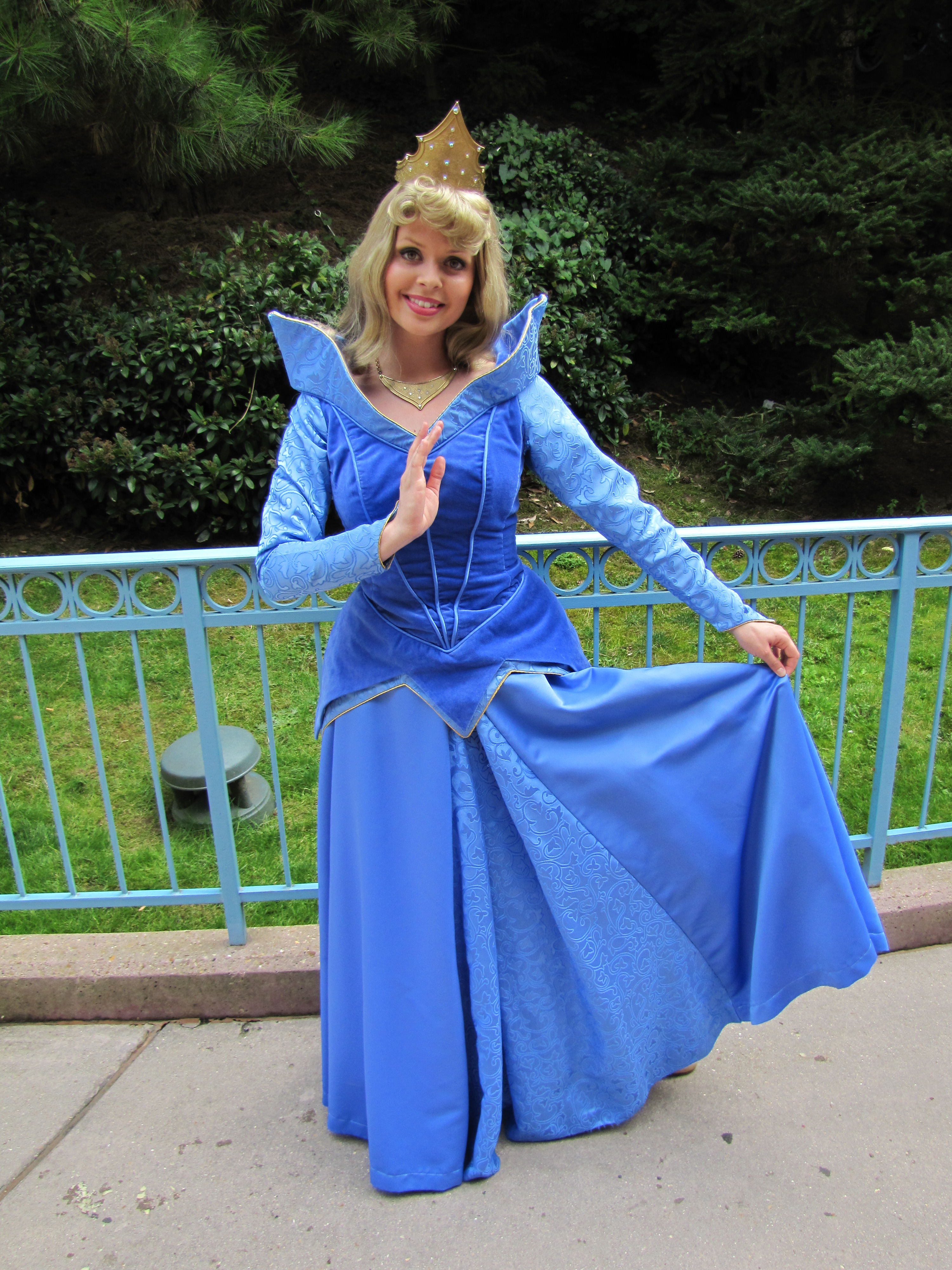 In Paris Aurora meets guests in her blue dress