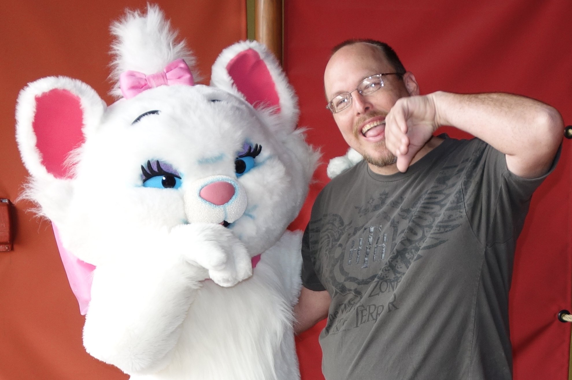 I enjoy interacting with the characters and not just taking a standard photo.  Marie told me that it looked like I need a quick cleaning for our formal pose.  We began by licking our paws.