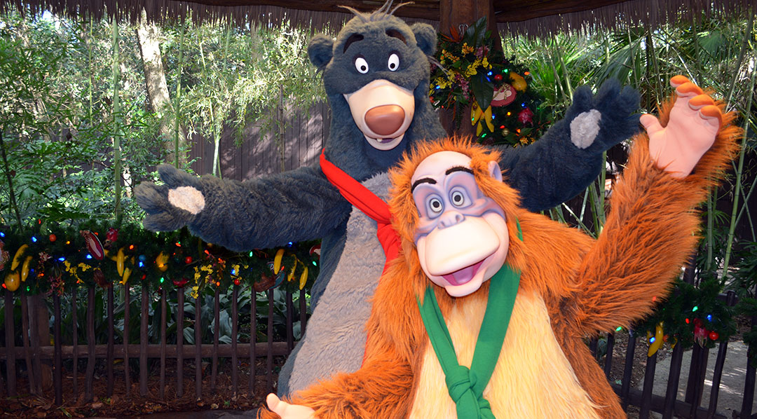 Baloo and King Louie in Christmas attire at Disney's Animal Kingdom