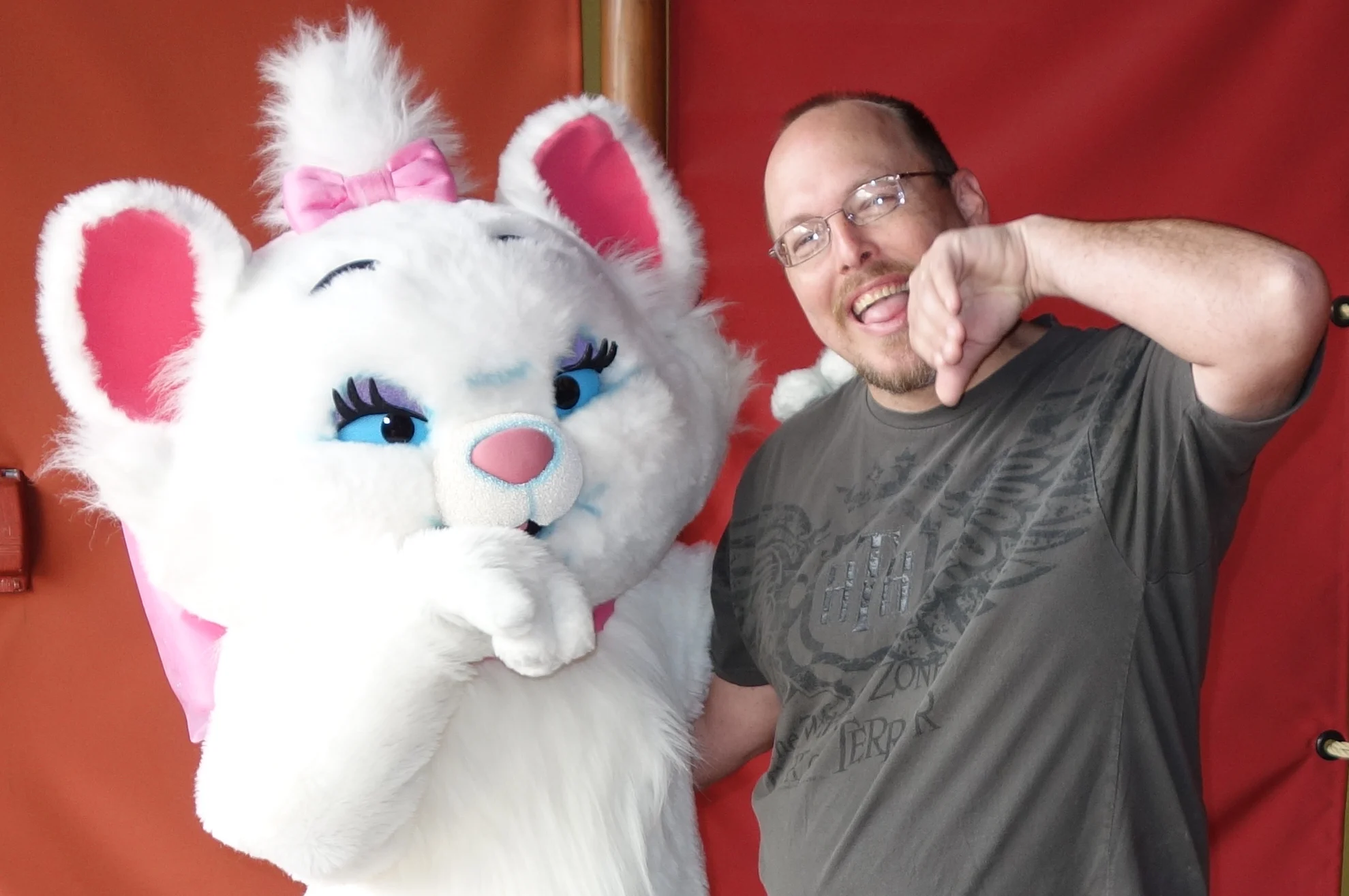 I enjoy interacting with the characters and not just taking a standard photo. Marie told me that it looked like I need a quick cleaning for our formal pose. We began by licking our paws.