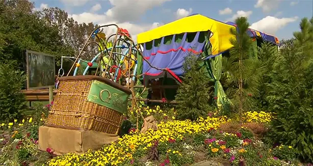 One of the primary thematic elements is a crashed balloon full of spring color and flowers.