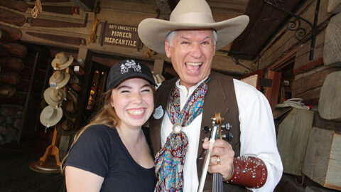 Farley the Fiddler gives my daughter a Fiddle playing lesson at Disneyland