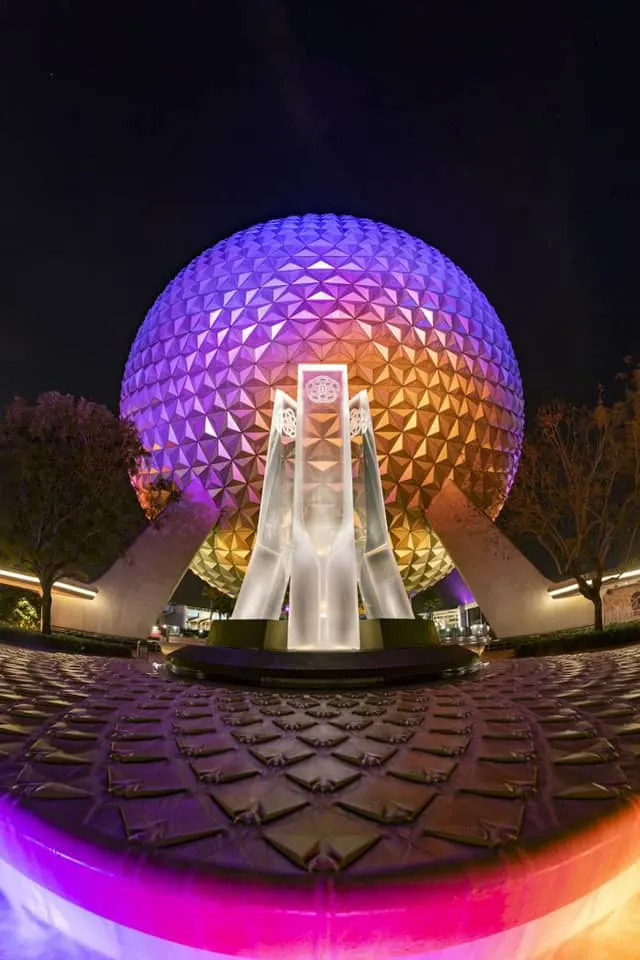 This image has an empty alt attribute; its file name is epcotpylonsnight.jpg