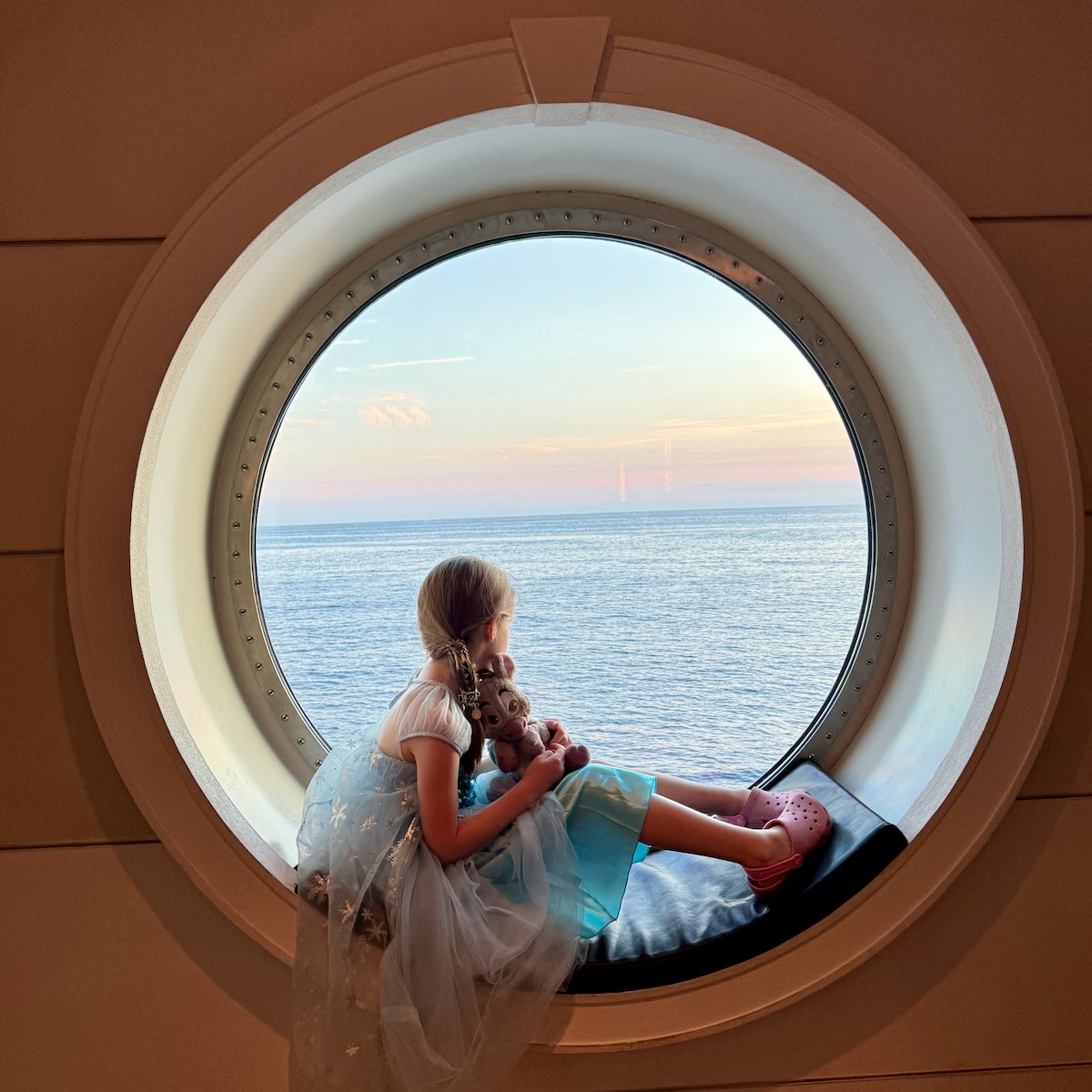 Child in a porthole Window DIsney Wish DCL